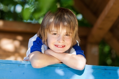 Boy playing on blue playground